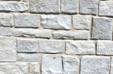 Close-up of arctic charleston cobble manufactured stone veneer H-series Commercial offering by Hedberg Home