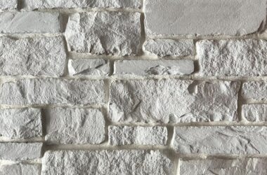 Close-up of arctic chiseled edge manufactured stone veneer H-series Commercial offering by Hedberg Home