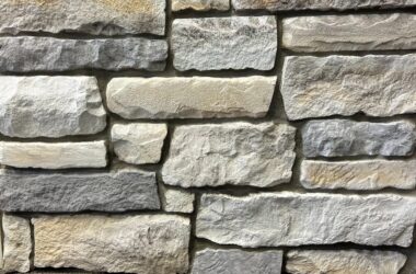 Close-up of autumn breeze chiseled edge manufactured stone veneer H-series Commercial offering by Hedberg Home