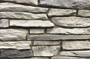 Close-up of autumn breeze granite ledge manufactured stone veneer H-series Commercial offering by Hedberg Home