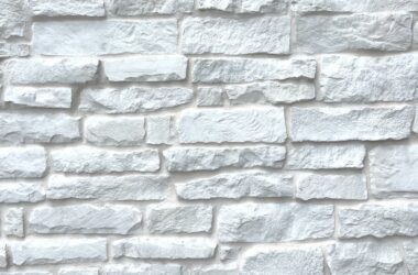 Close-up of brilliant white chiseled edge manufactured stone veneer H-series Commercial offering by Hedberg Home