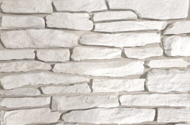 Close-up of brilliant white granite ledge manufactured stone veneer H-series Commercial offering by Hedberg Home