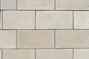 Close-up of buff biltmore smooth manufactured stone panels