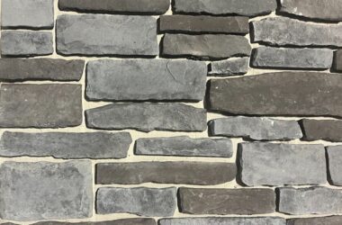 Close-up of carbon chiseled edge manufactured stone veneer