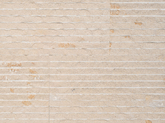 Closeup of AllClad Dune Split Chipped natural stone tile product