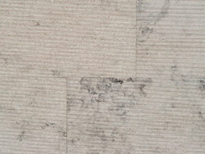 Closeup of AllClad Gaia Linear Raked natural stone tile product