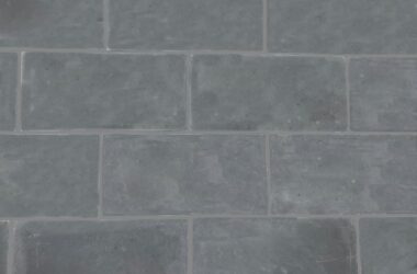 Close-up of grey biltmore smooth manufactured stone panels