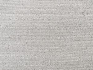 Closeup of AllClad Luna Linear Raked natural stone tile product