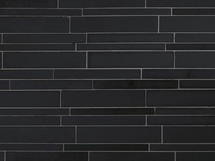 Close-up of ebony basalt lynia natural stone veneer on mesh product