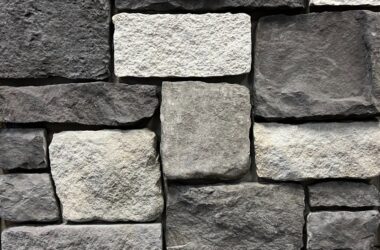 Close-up of old castle charleston cobble manufactured stone veneer H-series Commercial offering by Hedberg Home